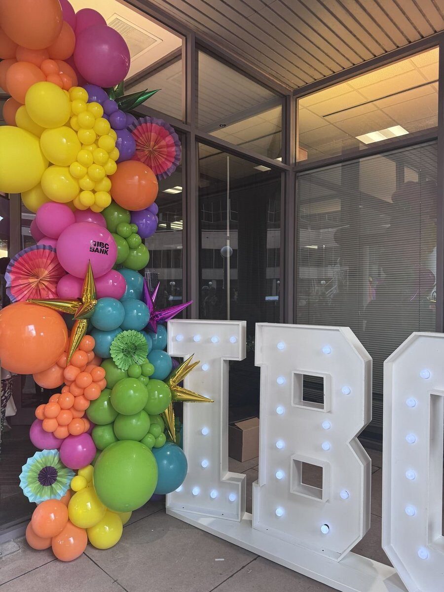 Fiesta-themed balloon arch for IBC Bank San Antonio corporate event